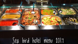 A buffet with various dishes including pasta, rice, and salads. - Hotel Sea Bird (Corfu)