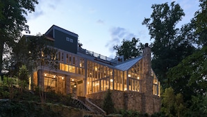 A modern house with a stone facade, large windows, and a sloped roof. - Goodstone Inn & Restaurant (Middleburg)