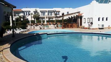 2 outdoor pools, pool umbrellas, pool loungers