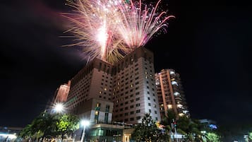 A hotel with multiple floors, large windows, and a modern architectural style.