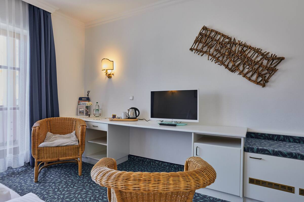 classic double room | living area | 32-inch flat-screen tv with satellite channels, tv