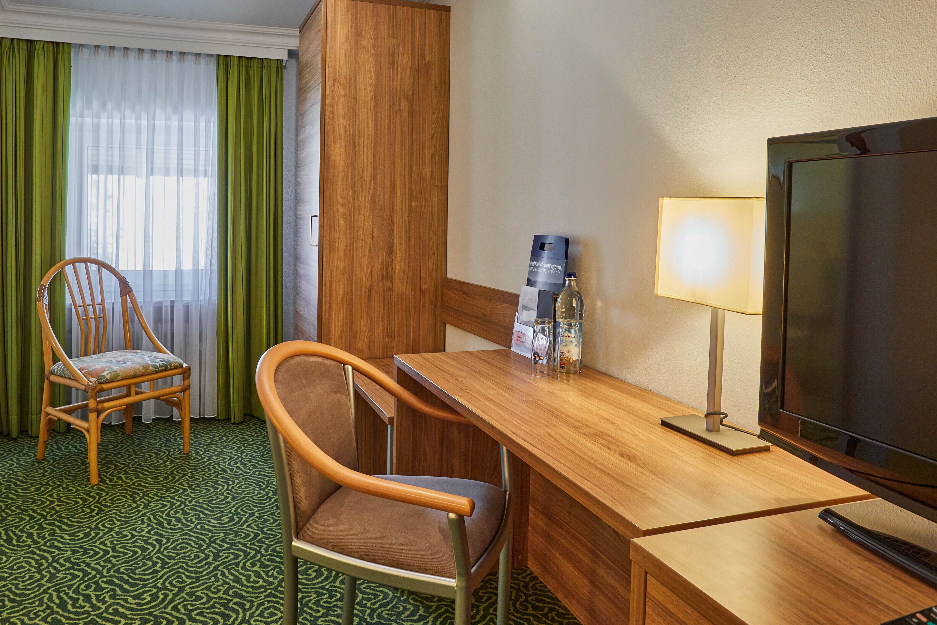 standard double room | living area | 32-inch flat-screen tv with satellite channels, tv