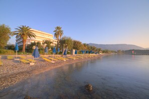 On the beach, sun loungers, beach umbrellas, beach towels