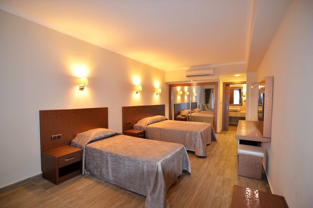 Deluxe Garden Room | 高級寢具、迷你吧、客房內保險箱、隔音