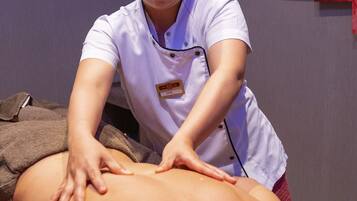 Experience a soothing massage therapy session in a serene spa setting, where skilled therapists offer expert care.
