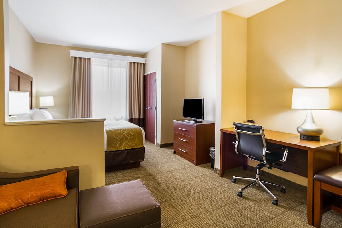 Desk, laptop workspace, blackout curtains, iron/ironing board