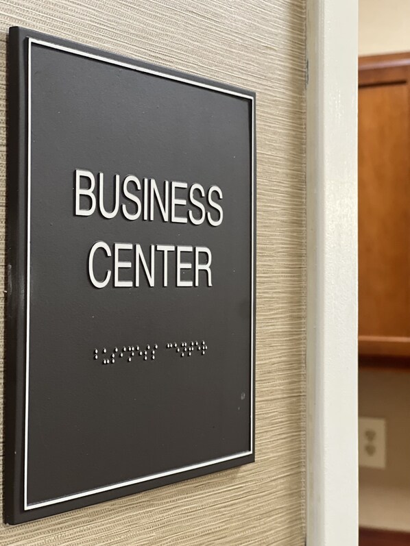 A sign labeled "BUSINESS CENTER" with Braille text below it. - Comfort Suites Twinsburg (Twinsburg)