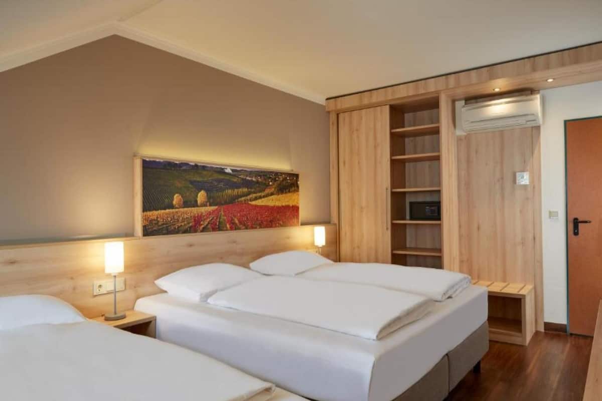 Family Room | Premium bedding, down comforters, desk, blackout drapes