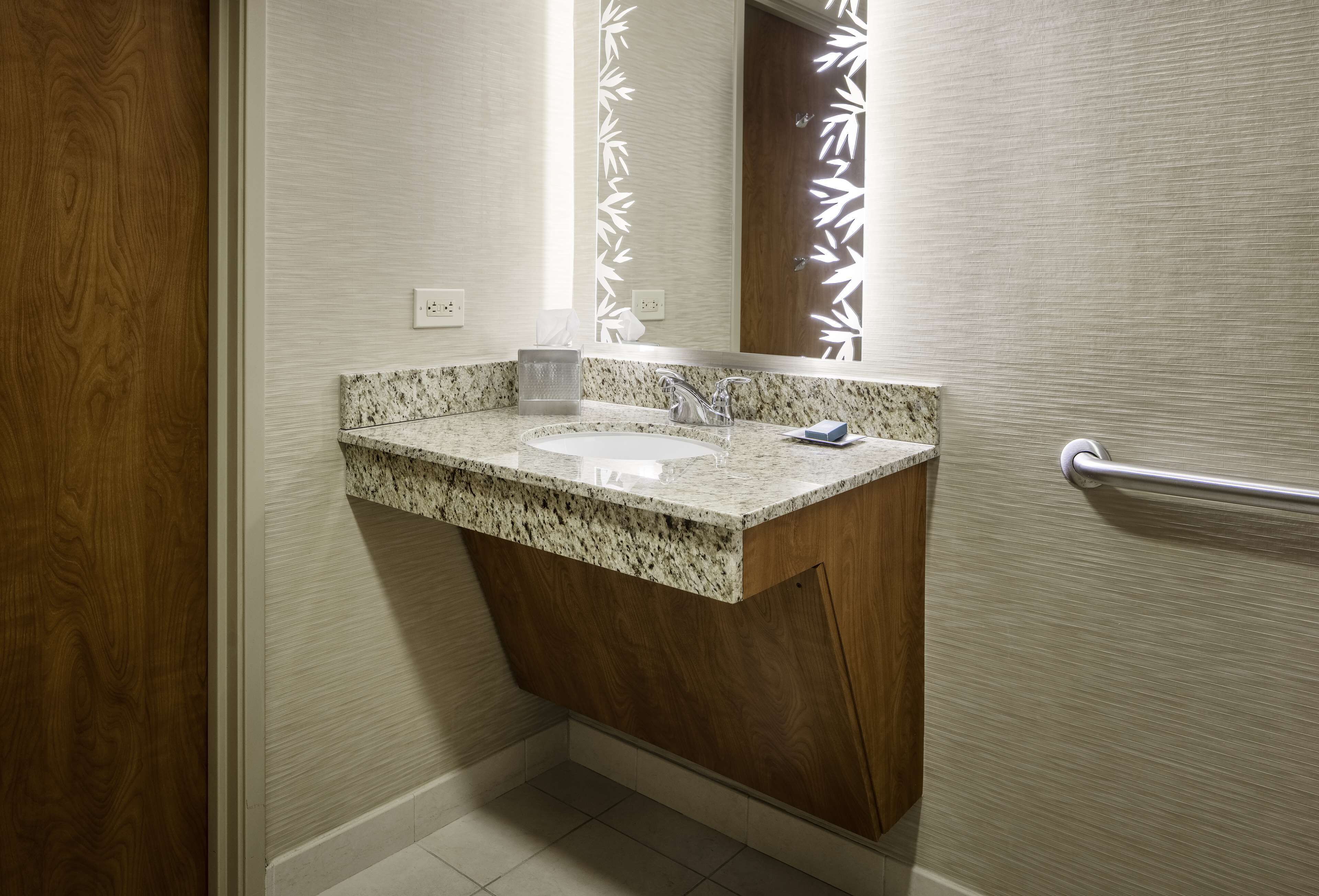 combined shower/bathtub, designer toiletries, hair dryer, towels