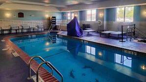 A swimming pool with diving boards, lounge chairs, and a covered seating area. - Holiday Inn Express Hotel & Suites Enid - Highway 412 by IHG (Enid)