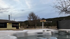 A hot tub area with a sign for Tower 64 Motel & RV Park. - Tower 64 Motel & RV Park (Trinidad)