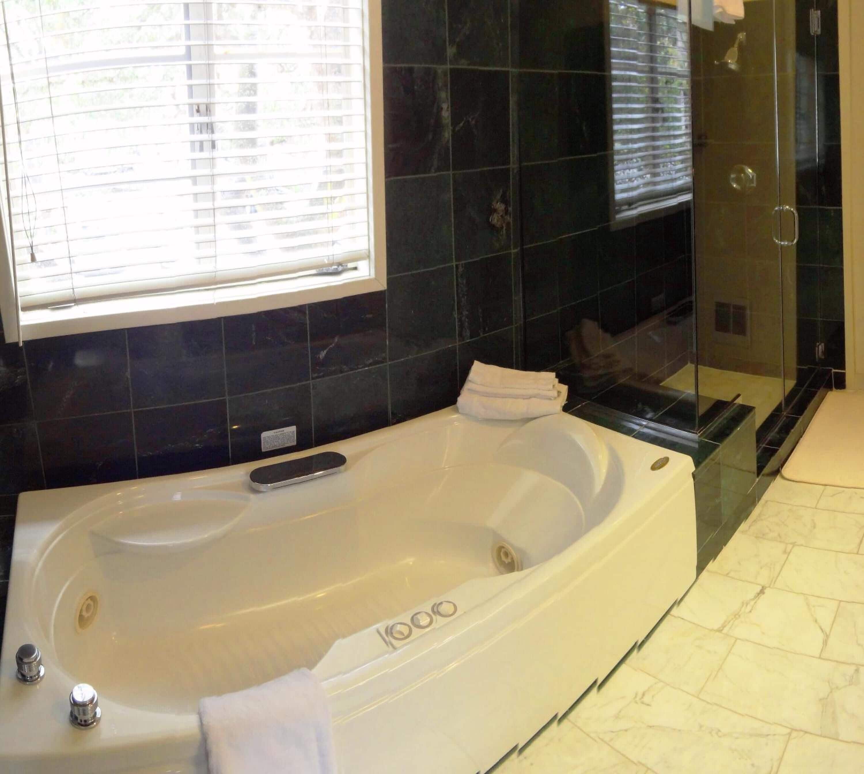 Separate bathtub and shower, jetted bath, hair dryer, bathrobes