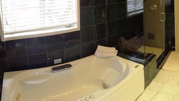 Separate bathtub and shower, jetted bath, hair dryer, bathrobes