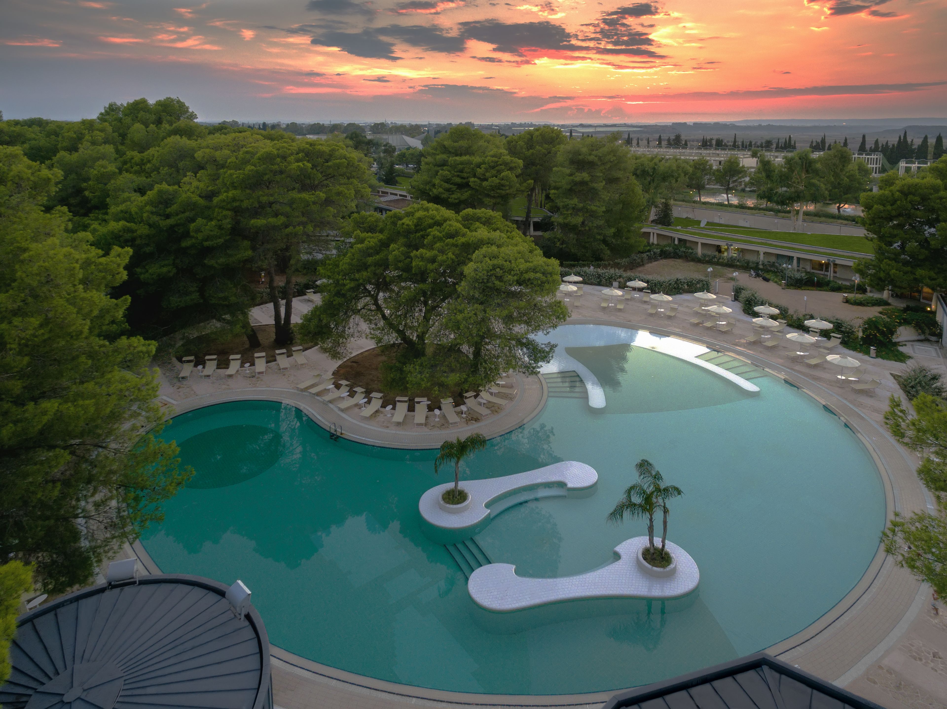 indoor pool, seasonal outdoor pool, pool umbrellas, pool loungers