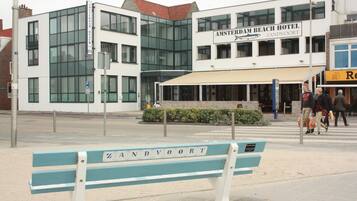 A modern building with a sign for Amsterdam Beach Hotel Zandvoort.