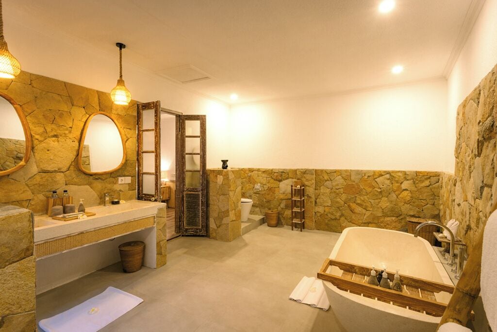deluxe family bungalow | bathroom | free toiletries, hair dryer, slippers, towels