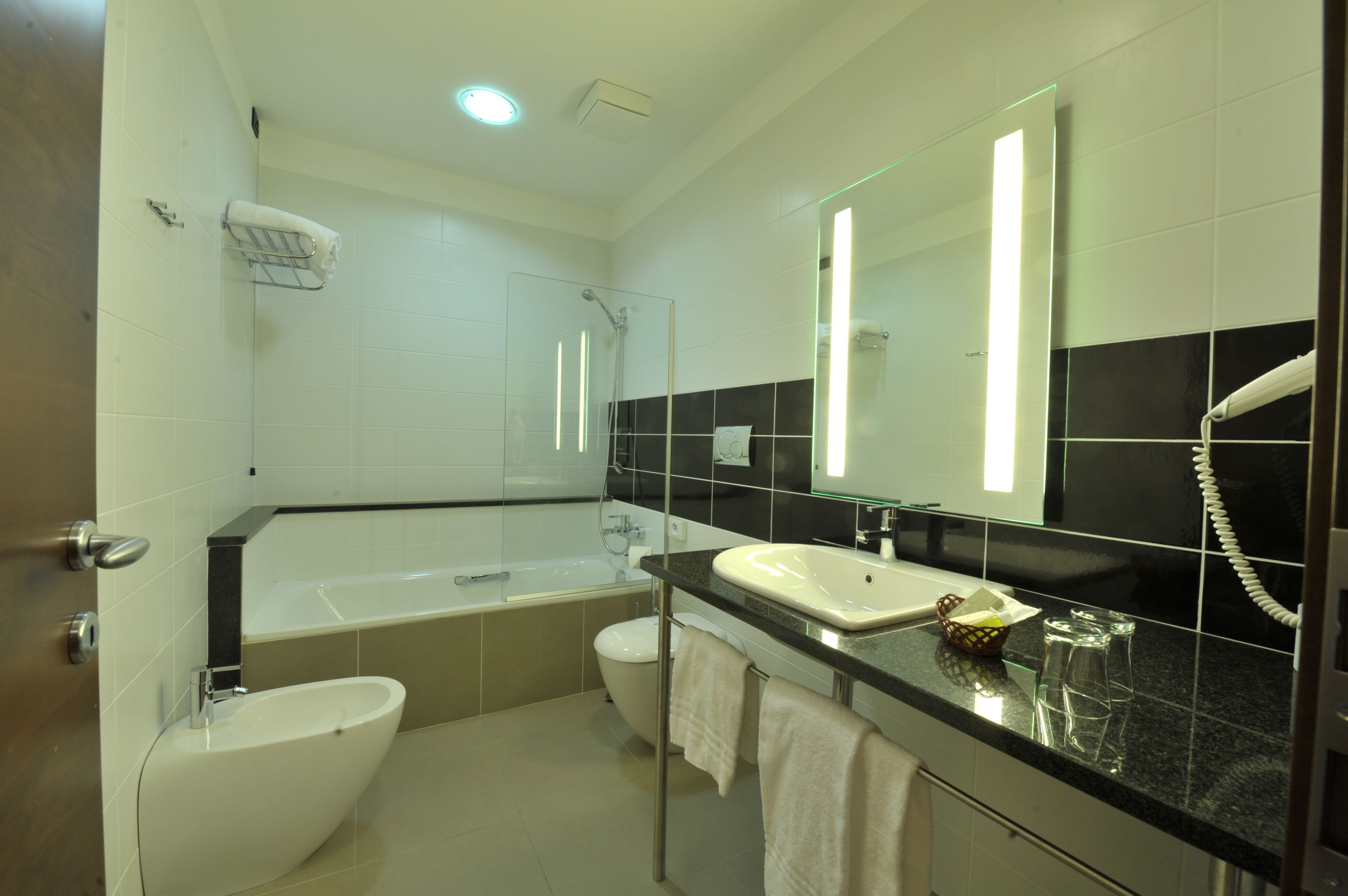 deluxe double room | bathroom | free toiletries, hair dryer, towels