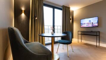 Deluxe Double Room | Living area | 40-inch Smart TV with digital channels