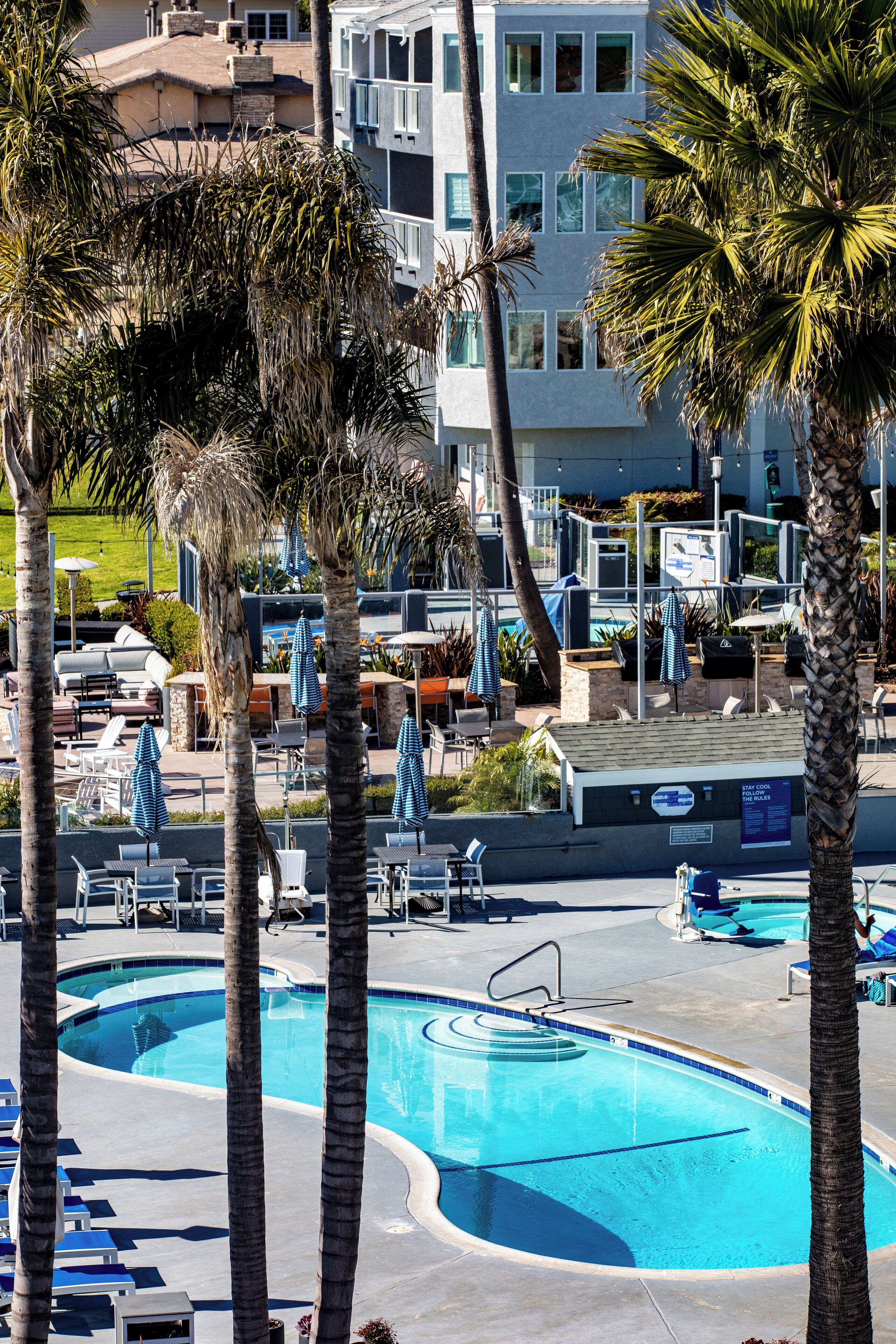 outdoor pool, open 8:00 am to 9:30 am, pool umbrellas, pool loungers