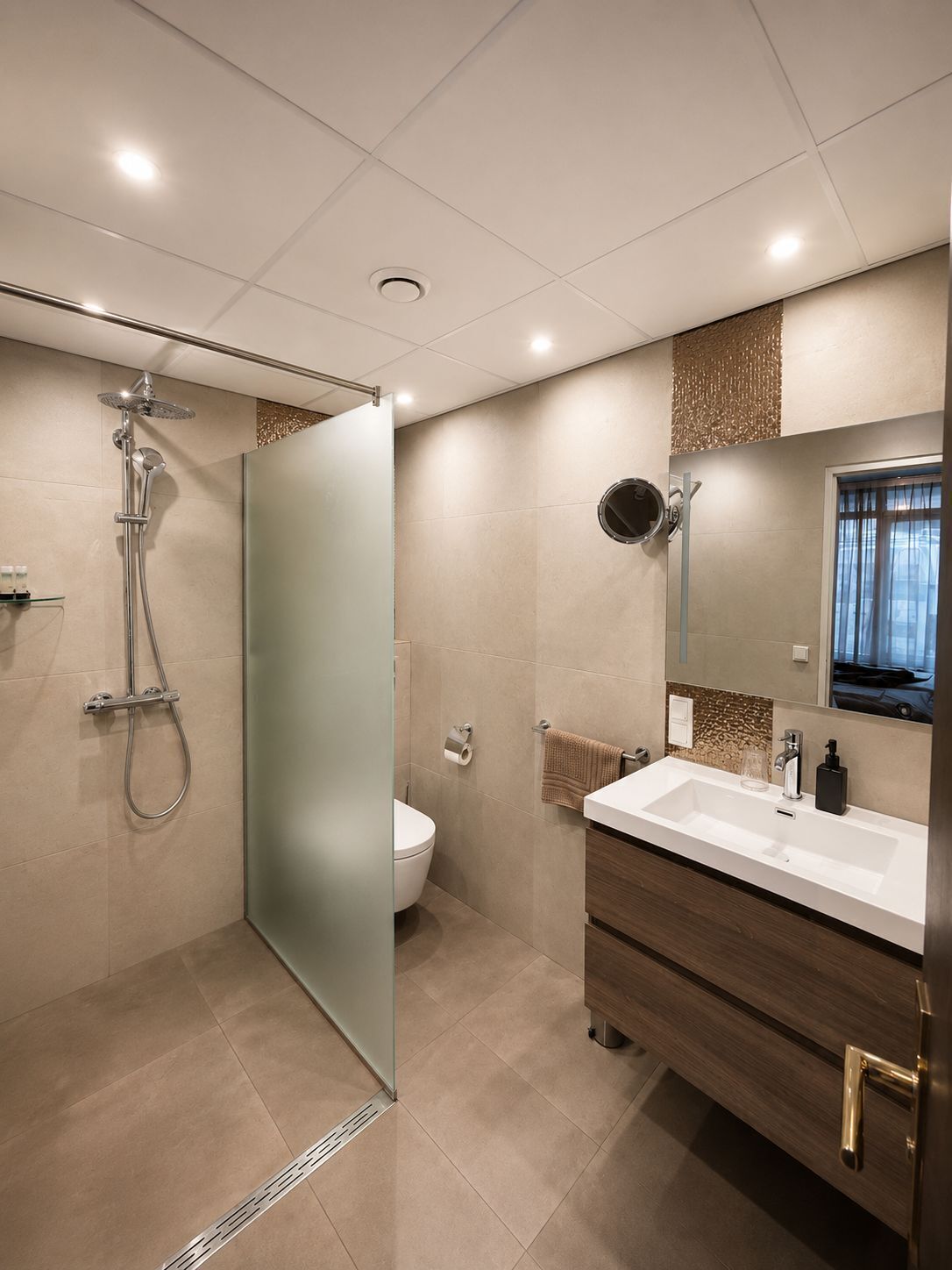 A modern bathroom with a glass shower enclosure, a toilet, a sink with a mirror, and a towel rack.