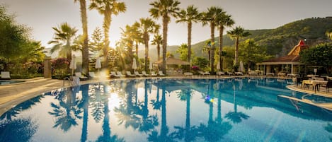 Indoor pool, 2 outdoor pools, open 10:00 AM to 7:00 PM, pool umbrellas