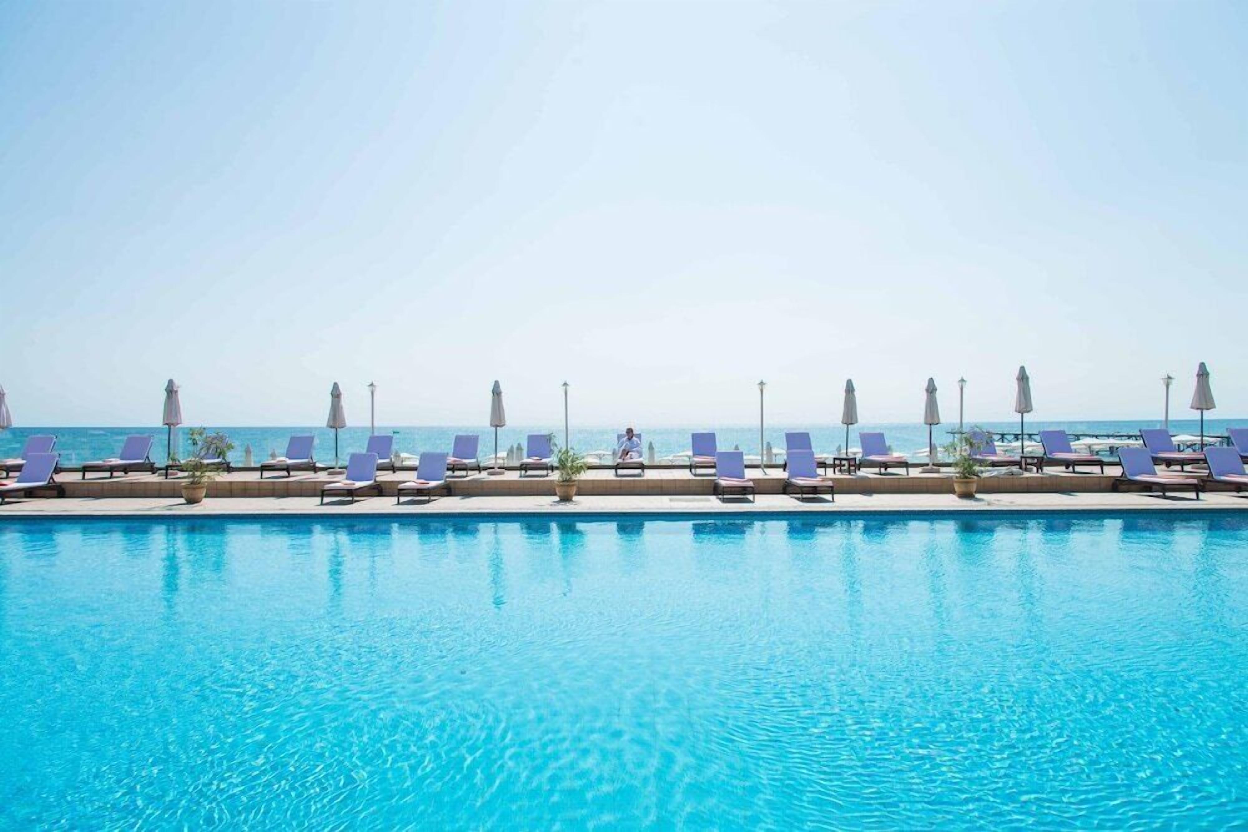 Indoor pool, outdoor pool, pool umbrellas, sun loungers