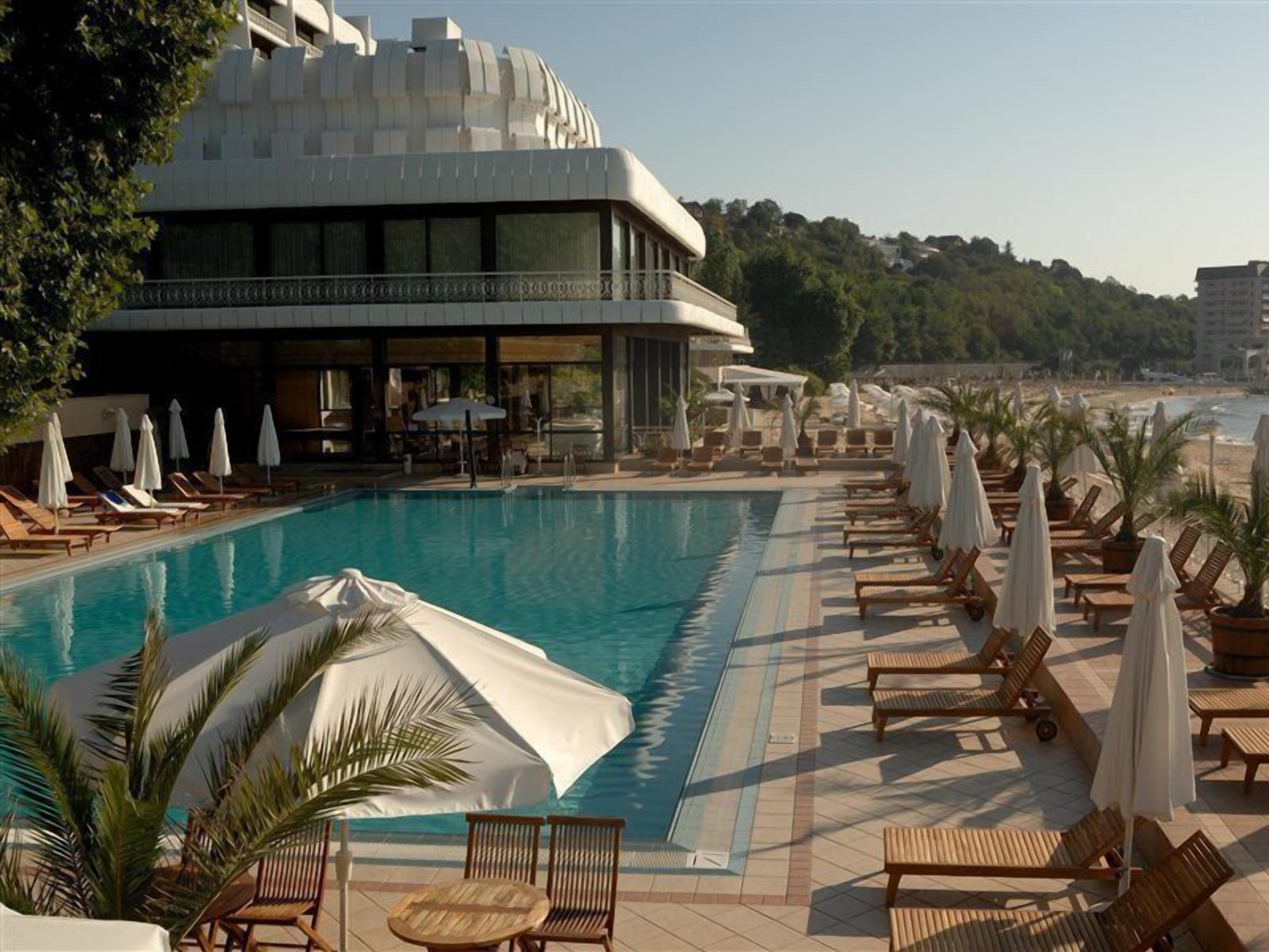 Indoor pool, outdoor pool, pool umbrellas, pool loungers