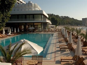 Indoor pool, outdoor pool, pool umbrellas, pool loungers