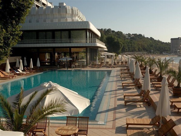 Indoor pool, outdoor pool, pool umbrellas, pool loungers