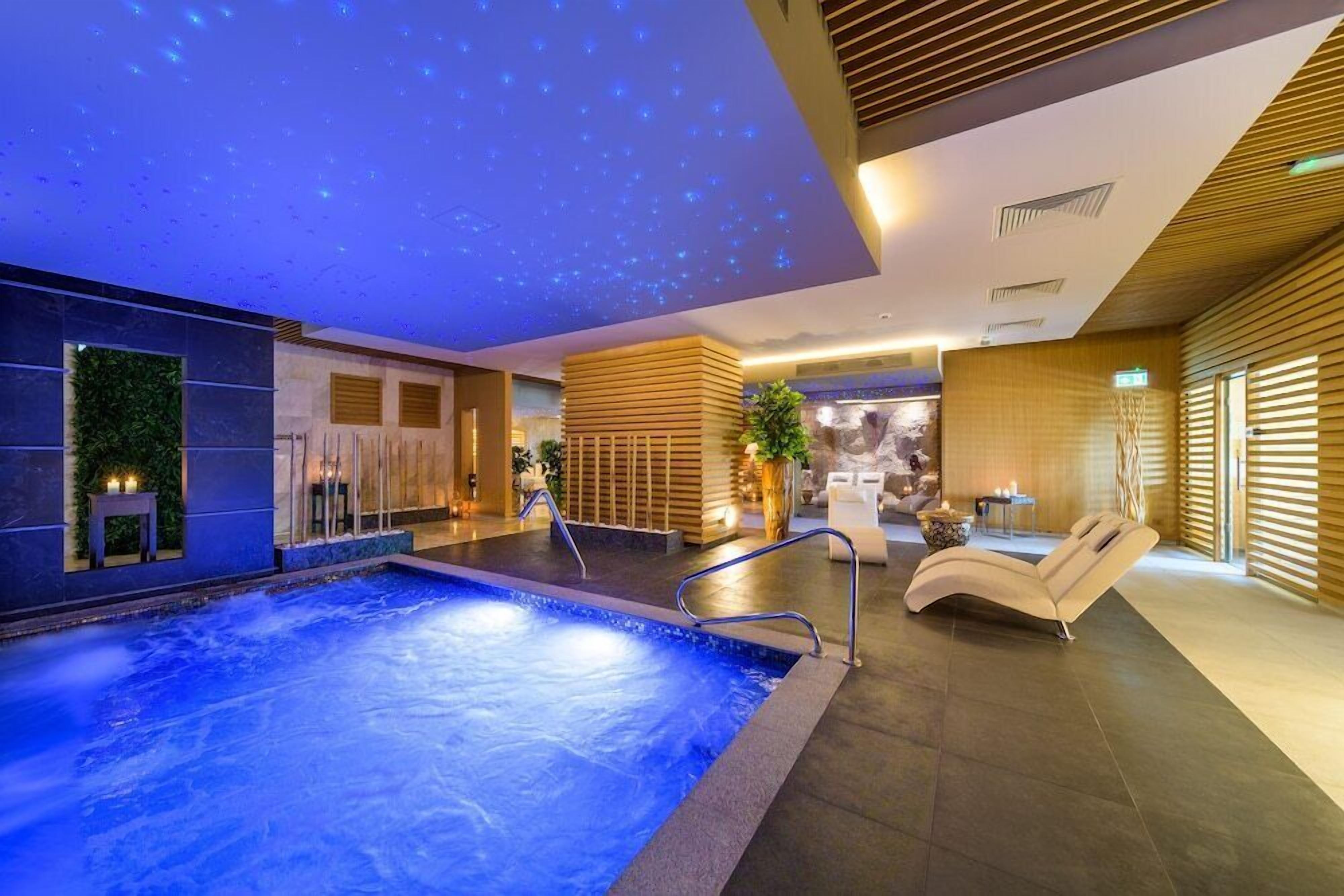 Indoor pool, outdoor pool, pool umbrellas, sun loungers