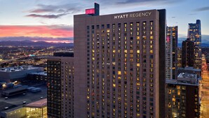 A high-rise building with the name 'HYATT REGENCY' prominently displayed.