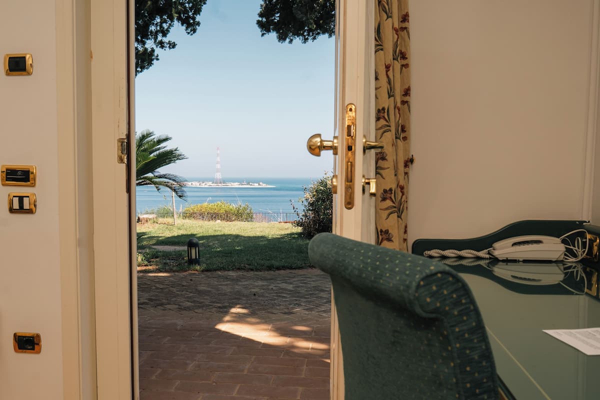 Classic Double or Twin Room, 1 Double or 2 Single Beds, Patio, Sea View | 1 bedroom, premium bedding, minibar, in-room safe