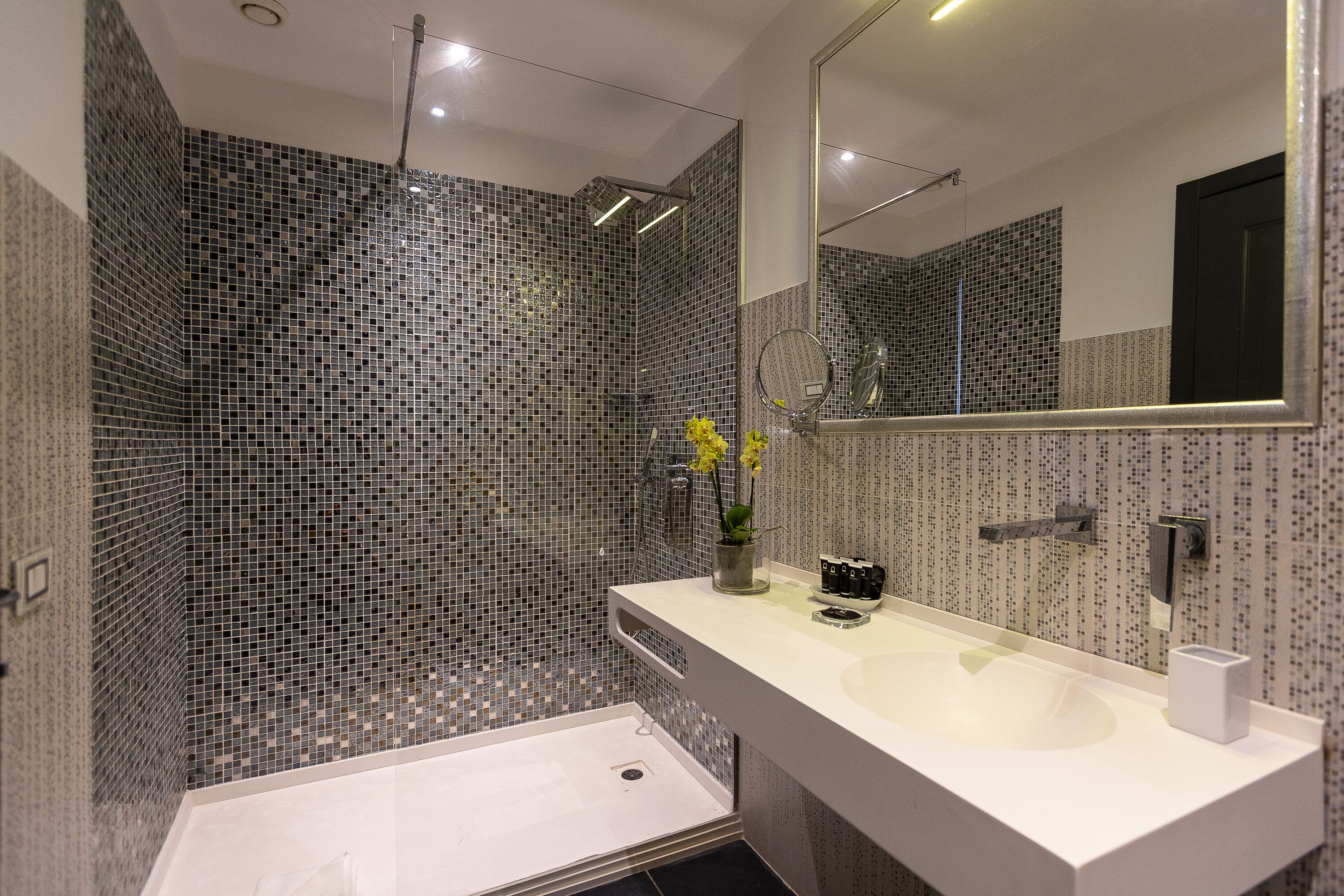 deluxe triple room | bathroom | rainfall showerhead, free toiletries, hair dryer, slippers
