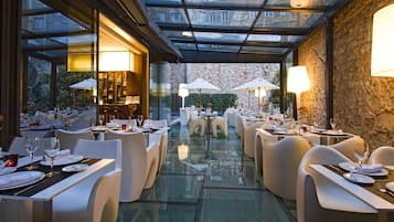 Breakfast, lunch, dinner served; Mediterranean cuisine, garden views