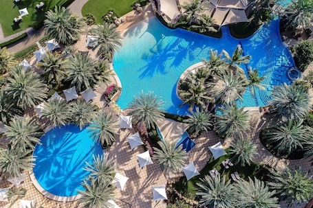 2 outdoor pools, open 6:00 AM to 7:00 PM, pool umbrellas, sun loungers