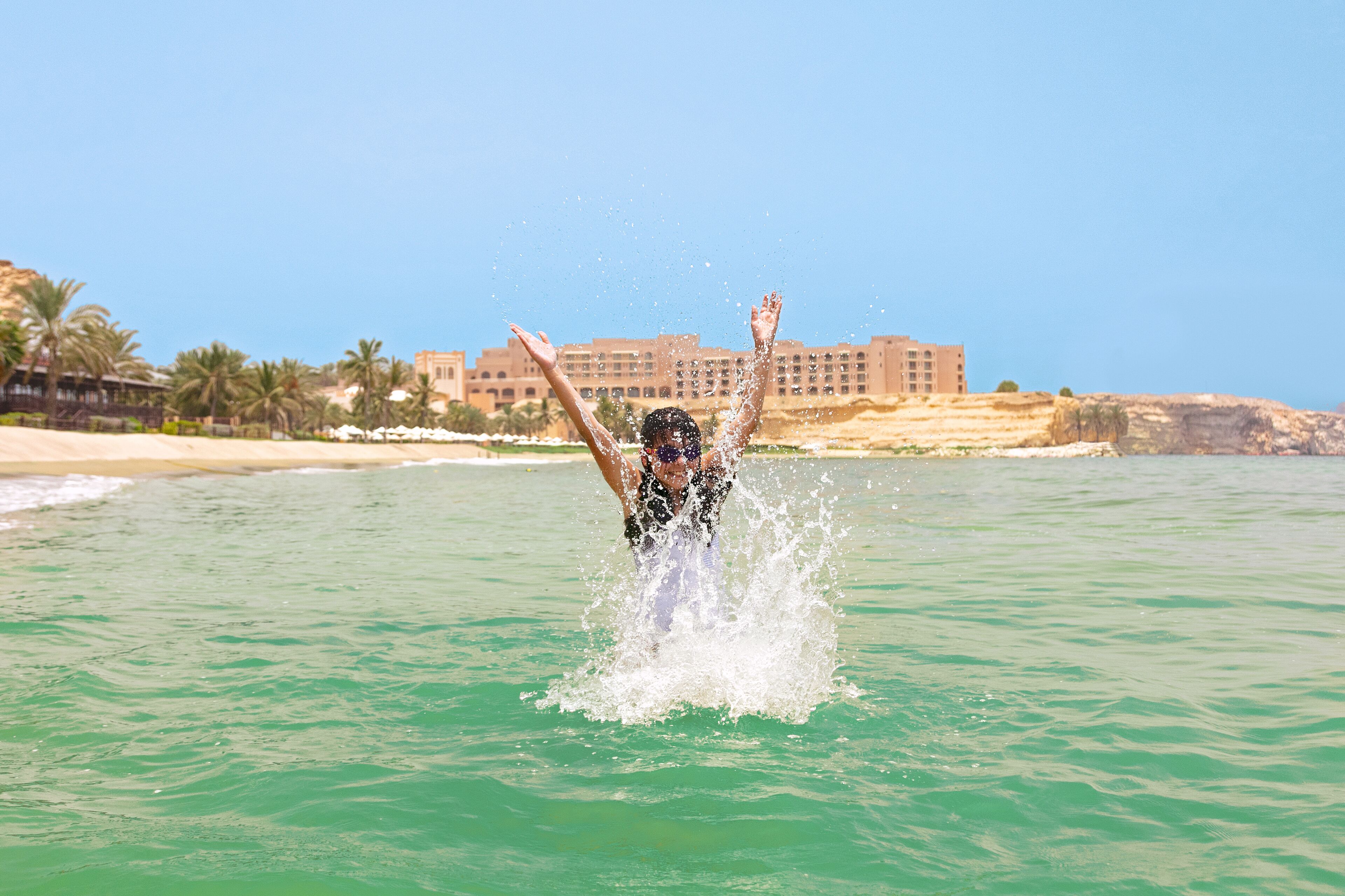 on the beach, sun-loungers, beach umbrellas, beach towels