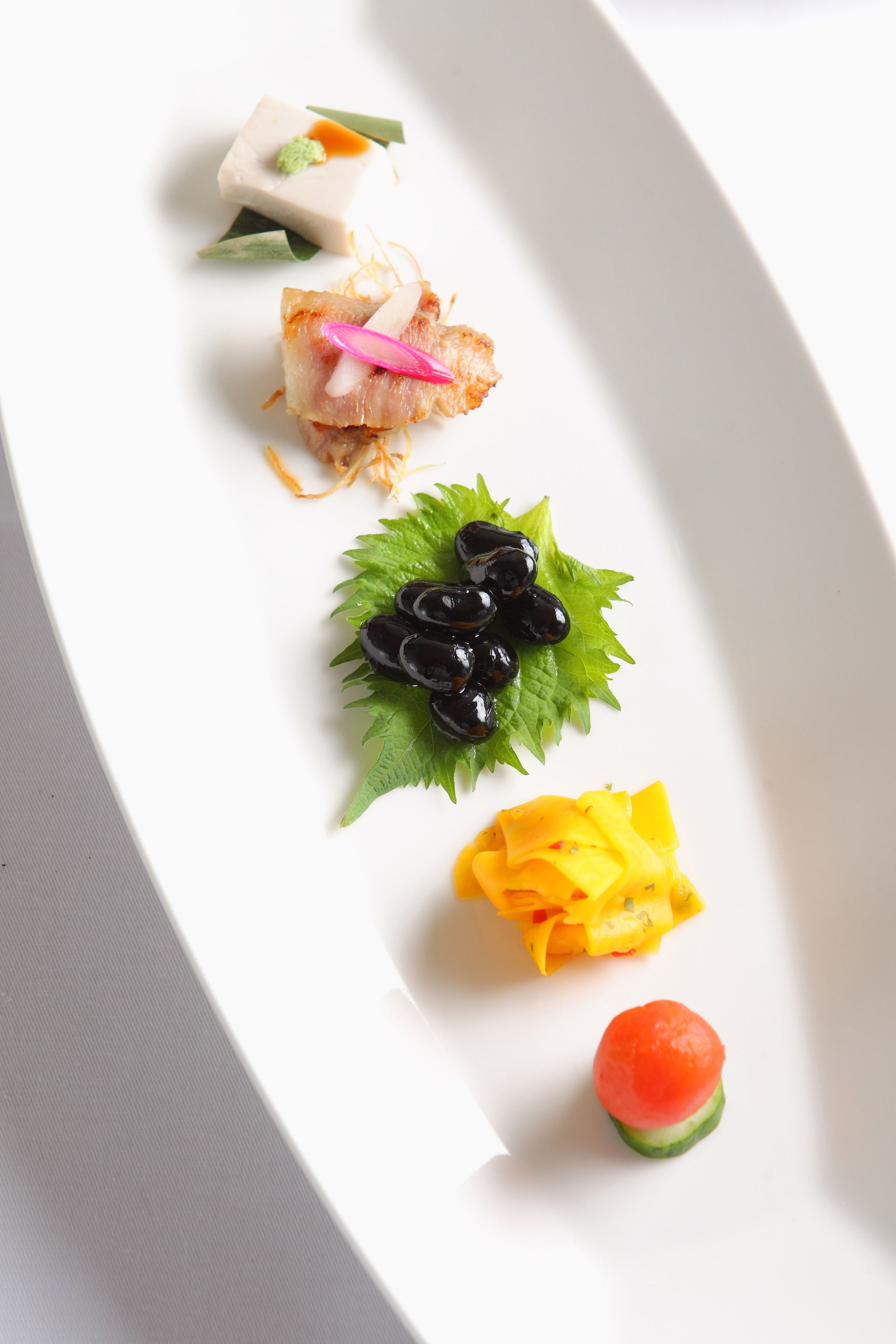 A white plate with various food items.