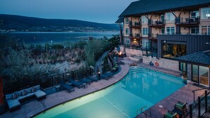 A hotel with a swimming pool, outdoor seating, and a view of the water. - Summerland Waterfront Resort & Spa (Summerland)
