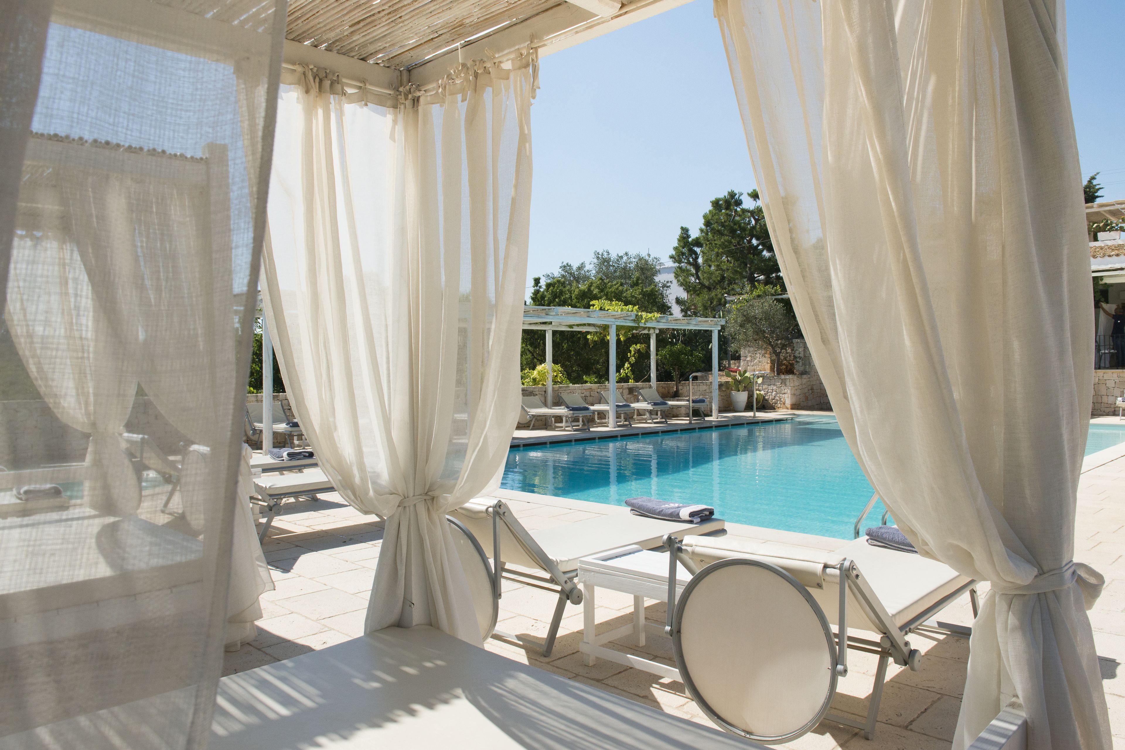 seasonal outdoor pool, pool umbrellas, pool loungers