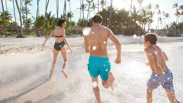Private beach, white sand, sun loungers, beach umbrellas