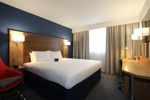 A hotel room with a large bed, a desk, a chair, and a mirror. - Holiday Inn Express Nuneaton by IHG (Nuneaton)
