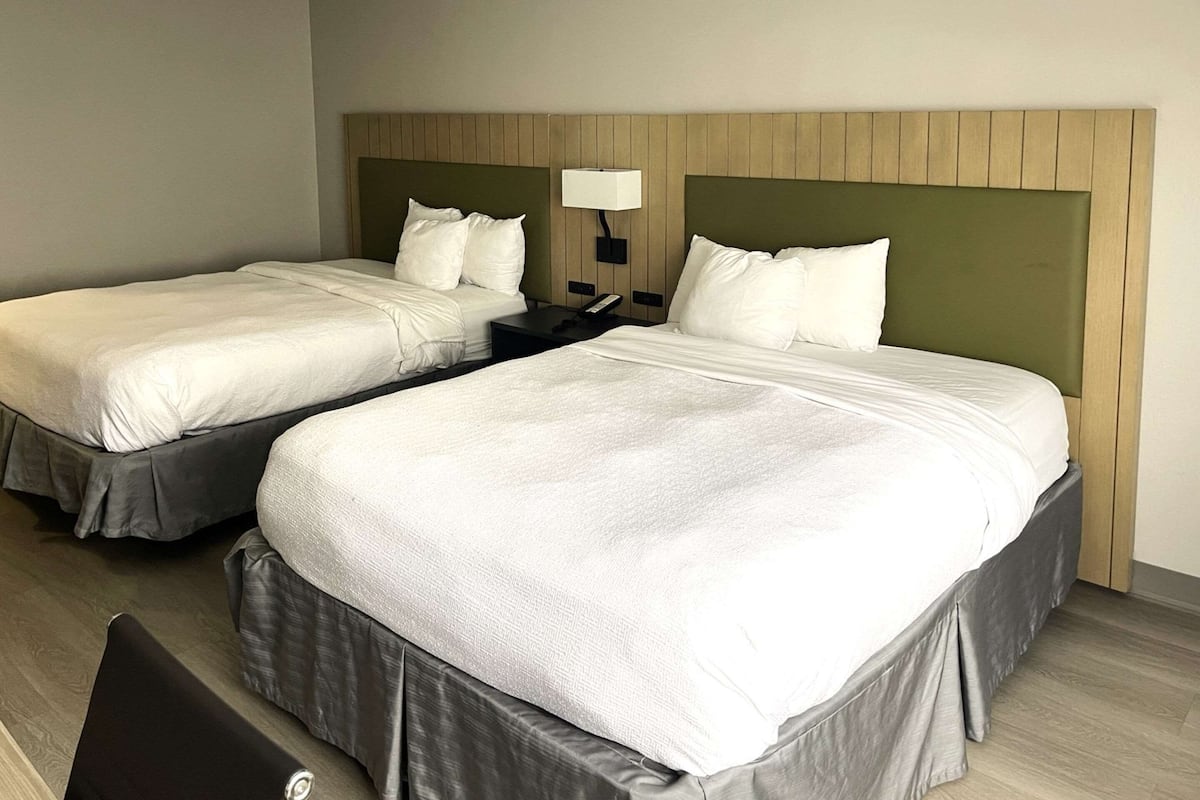 Room, 2 Queen Beds, Non Smoking | 1 bedroom, desk, iron/ironing board, free cribs/infant beds