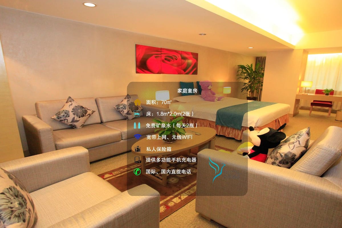 A modern living room with a sofa set, a coffee table, and a painting on the wall.