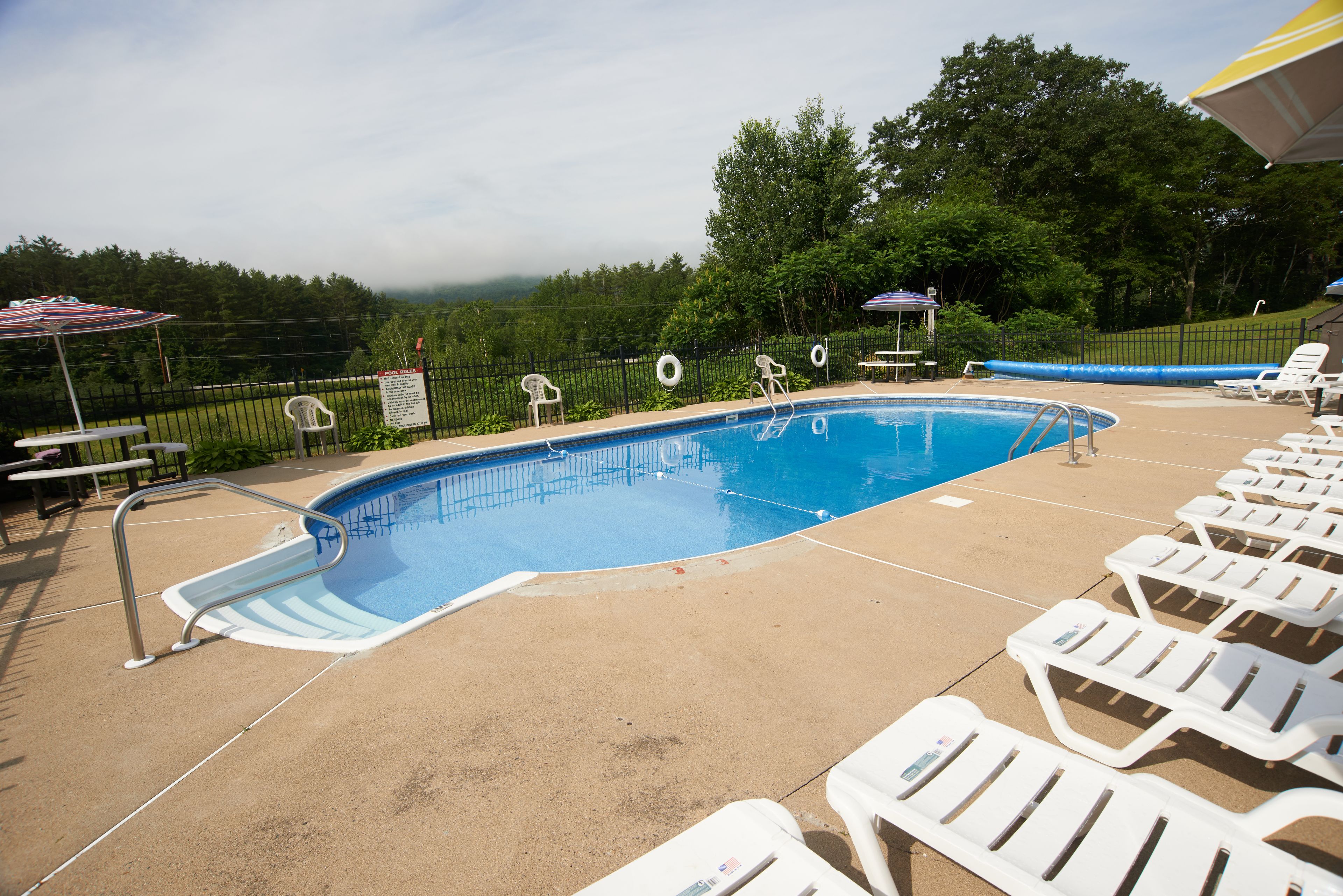 seasonal outdoor pool, open 9:00 am to 9:00 pm, pool umbrellas