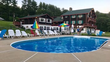 Seasonal outdoor pool, open 9:00 AM to 9:00 PM, pool umbrellas