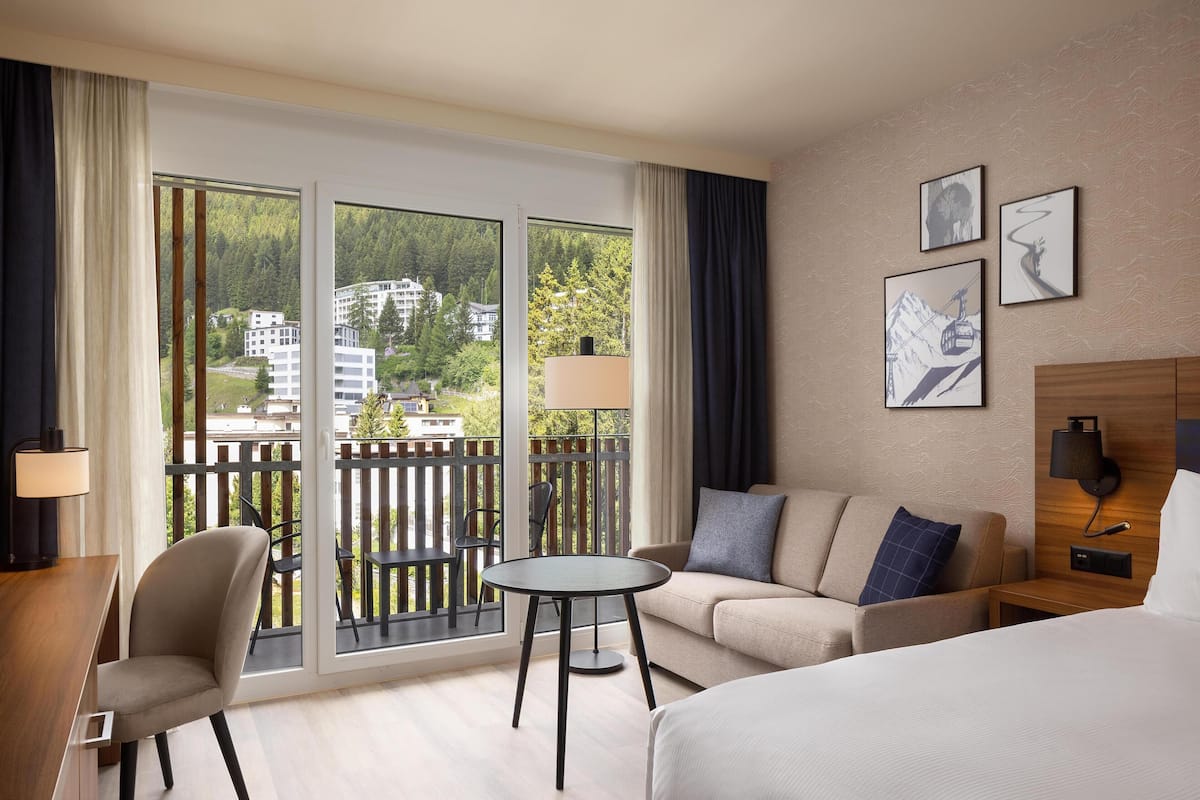 Family Room, 1 Queen Bed | Living area | 55-inch flat-screen TV with satellite channels, TV
