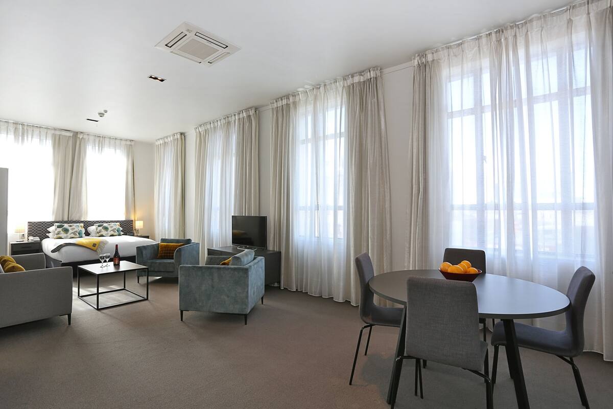 Premium bedding, desk, blackout curtains, iron/ironing board