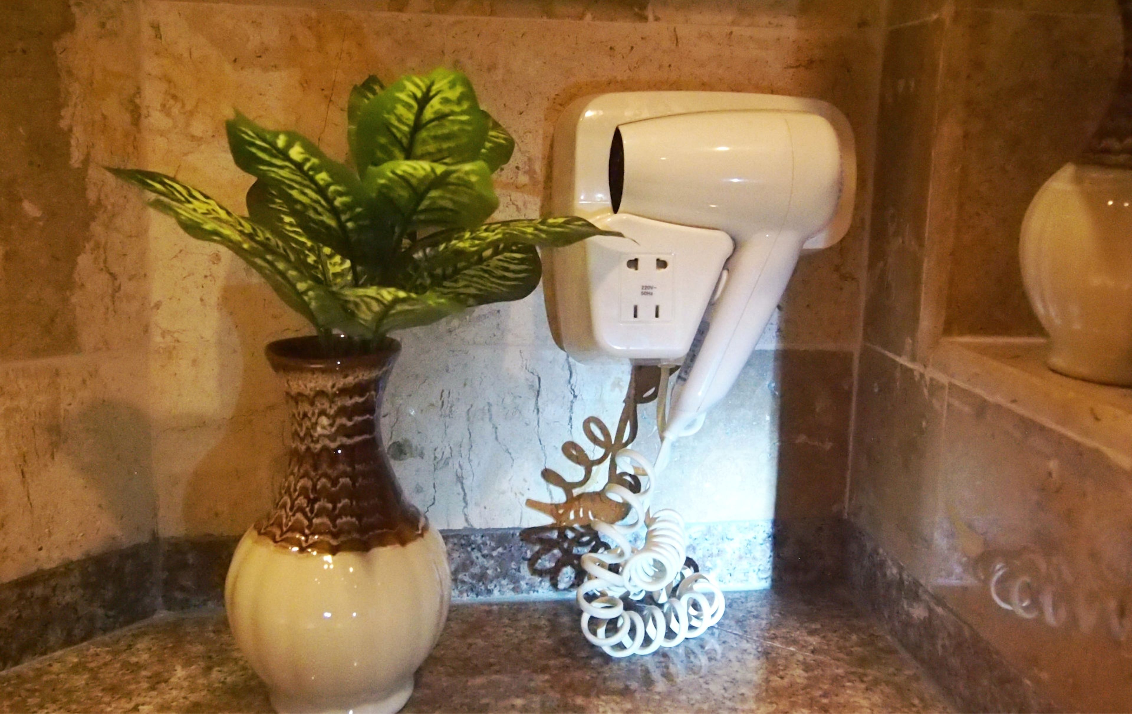 eco-friendly toiletries, hair dryer, bathrobes, slippers