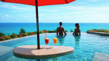 Outdoor pool, pool umbrellas, sun loungers