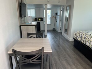 Deluxe Room, 1 King Bed, Accessible Bathtub, Kitchenette | In-room dining - The Bayside Inn & Marina (Treasure Island)